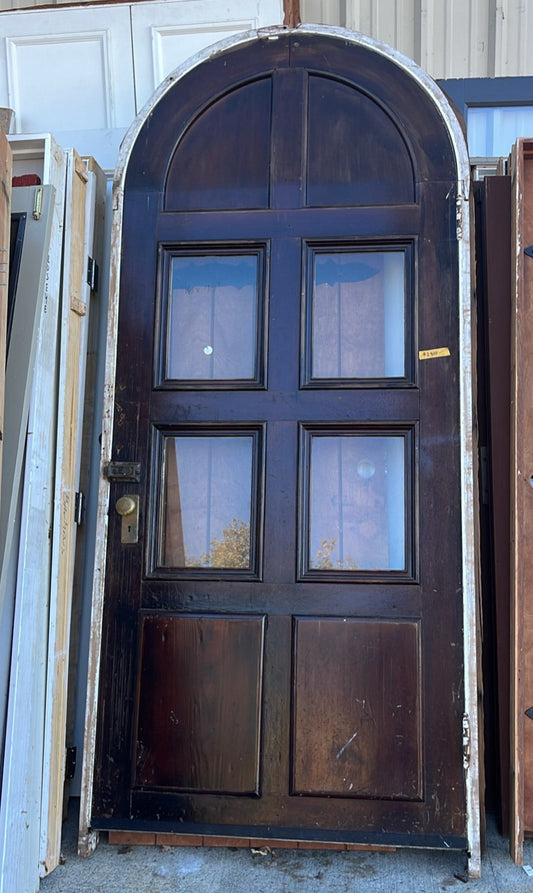 1920s arched antique wood door with windows salvage
