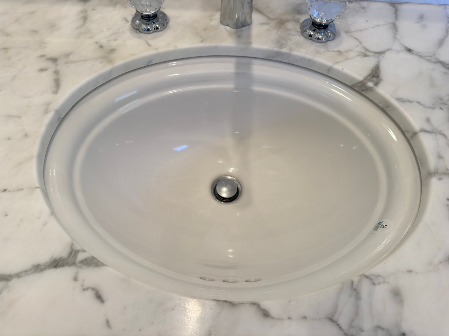 White vanity with mirrored front; Faucet by Jörger Florale collection