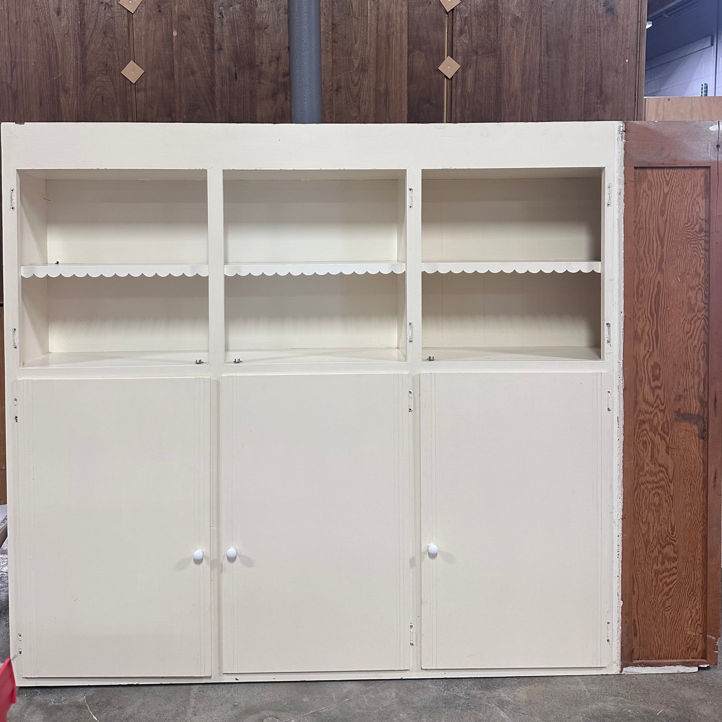 White cabinet with scalloped detailing