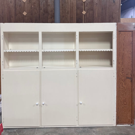 White cabinet with scalloped detailing